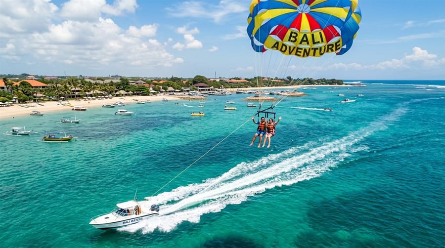 Parasailing over turquoise water at Tanjung Benoa, Bali