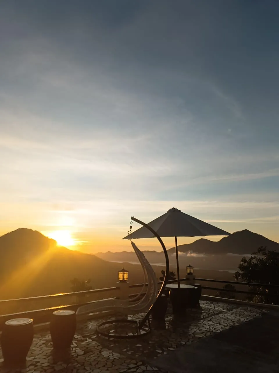 The sun rising over the silhouette of Mount Batur volcano in Kintamani, Bali, at dawn