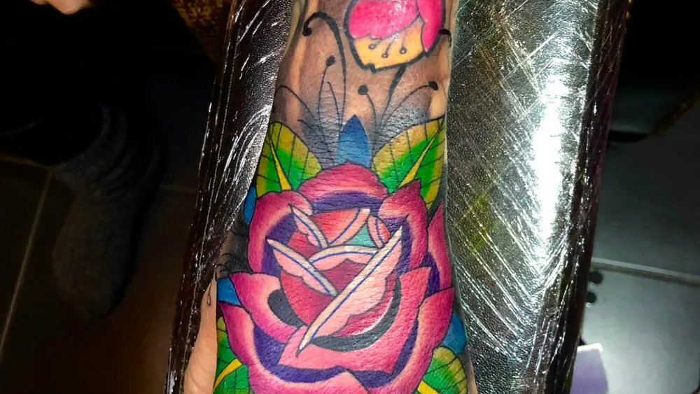 A colour rose hand tattoo done at a Kuta tattoo studio in Bali