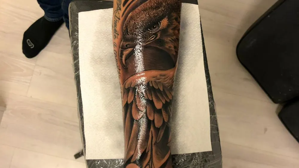 A black-and-grey realism eagle tattoo done at a Kuta studio in Bali