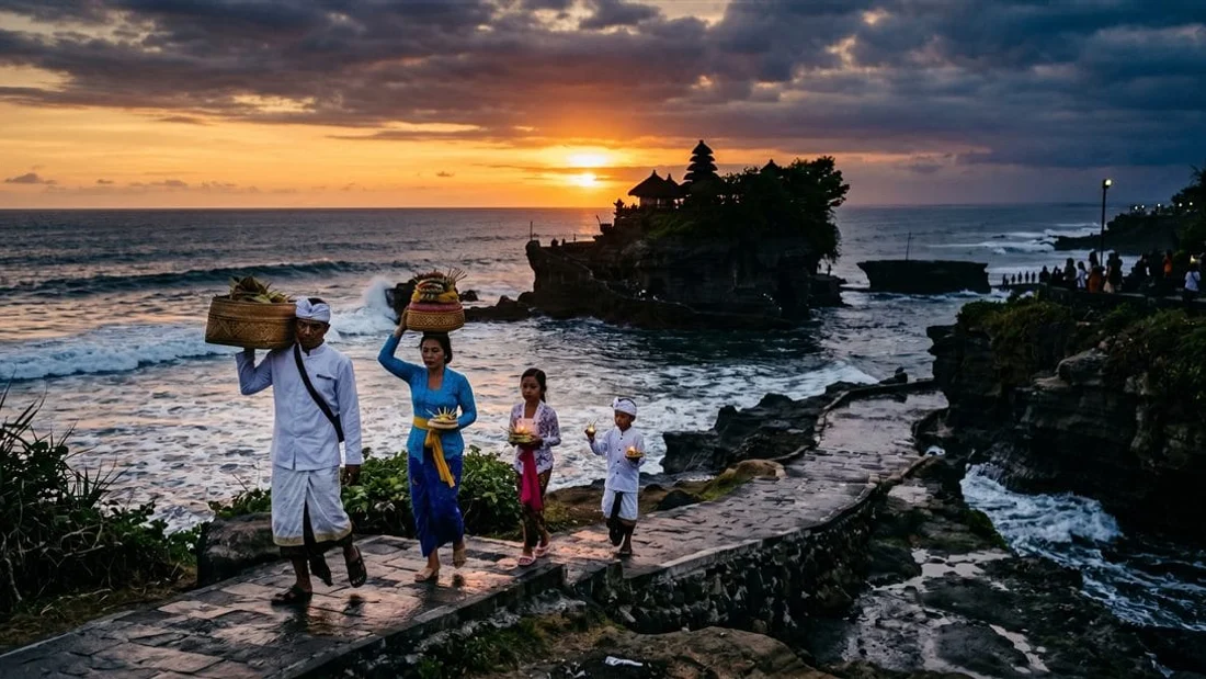 Visitors in sarongs and sashes at a Balinese temple gate in Bali