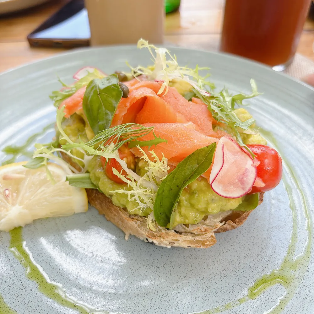 Smoked salmon avocado toast on a plate at TIS Cafe near Ubud, Bali
