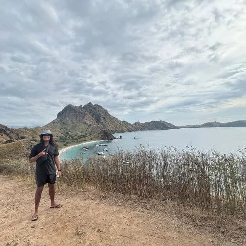 Padar Island viewpoint with turquoise bays and rugged hills, a highlight of a Komodo island-hopping trip